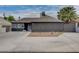 Charming single-story home with a wide driveway, desert landscaping, and a secure fenced perimeter at 1414 S 13Th St, Las Vegas, NV 89104