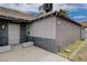 A close up, side view of a renovated house with rock and siding, a locked door and stone benches at 1414 S 13Th St, Las Vegas, NV 89104