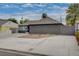 View of the house with a driveway and landscaping, highlighting the home's curb appeal and exterior features at 1414 S 13Th St, Las Vegas, NV 89104