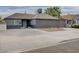 A lovely home features a spacious driveway with modern exterior paint, enhancing its curb appeal and charm at 1414 S 13Th St, Las Vegas, NV 89104