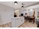 Open floor plan with a large island and modern kitchen, seamlessly connecting to a dining area and living space at 1414 S 13Th St, Las Vegas, NV 89104