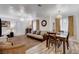 Comfortable living room with sofa, dining table and chairs, neutral colors, and bright natural light at 1414 S 13Th St, Las Vegas, NV 89104