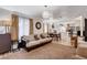 Open-concept living room with plush seating, hardwood floors, and views into the adjacent kitchen and dining area at 1414 S 13Th St, Las Vegas, NV 89104