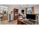 The charming office is fully furnished with modern lighting, a bookcase, and light wood laminate flooring at 1414 S 13Th St, Las Vegas, NV 89104
