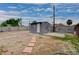 The backyard shed features a neutral gray exterior, providing ample storage or workshop space at 1414 S 13Th St, Las Vegas, NV 89104
