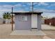 A close up shows the backyard shed. The gray exterior offers a functional and understated design at 1414 S 13Th St, Las Vegas, NV 89104