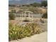 Artistic backyard featuring a decorative bridge and lush greenery, adding charm to the landscape at 1461 E Elderberry St, Pahrump, NV 89048