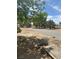Landscaped backyard with mature trees, gravel groundcover, and open space at 1461 E Elderberry St, Pahrump, NV 89048