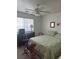 Bedroom featuring carpeted floors, a ceiling fan, window with blinds and vintage decor at 1461 E Elderberry St, Pahrump, NV 89048