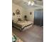 Cozy bedroom with neutral carpet, ceiling fan, quaint decor and a window with privacy blinds at 1461 E Elderberry St, Pahrump, NV 89048