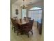 Cozy dining room featuring a wooden table set and natural light from large window at 1461 E Elderberry St, Pahrump, NV 89048