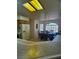 An open concept kitchen overlooks a dining room and has plenty of storage space at 1461 E Elderberry St, Pahrump, NV 89048