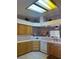 Charming kitchen with wood cabinets, tile countertops, and a bright, airy feel at 1461 E Elderberry St, Pahrump, NV 89048