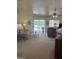 Open living area with sliding glass doors and neutral carpet, perfect for gatherings at 1461 E Elderberry St, Pahrump, NV 89048