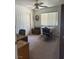 Cozy home office featuring neutral walls, functional desk space, and a ceiling fan with lighting at 1461 E Elderberry St, Pahrump, NV 89048