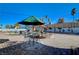 Backyard with paver patio, seating area, mature trees, and lush landscaping at 1631 Ottawa Dr, Las Vegas, NV 89169