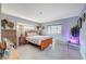 Well-lit bedroom with tile flooring, a window, and wooden dresser at 1631 Ottawa Dr, Las Vegas, NV 89169