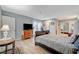 Comfortable bedroom featuring stylish light flooring, closet doors, and an outdoor entrance at 1631 Ottawa Dr, Las Vegas, NV 89169