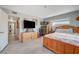 Bedroom with light gray walls, wood furnishings, a large window and an ensuite entrance at 1631 Ottawa Dr, Las Vegas, NV 89169