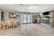 Dining area with a stone fireplace and access to the backyard through glass doors at 1631 Ottawa Dr, Las Vegas, NV 89169