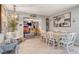 Stylish dining room with modern chandelier and view of the in-home bar at 1631 Ottawa Dr, Las Vegas, NV 89169