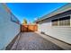 Driveway next to house features pavers, gate and access to the backyard at 1631 Ottawa Dr, Las Vegas, NV 89169