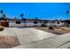 Charming single-story home with a spacious driveway and desert landscaping at 1631 Ottawa Dr, Las Vegas, NV 89169
