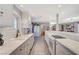 Well-lit kitchen featuring white cabinets, countertops, and an eat-in bar and breakfast nook at 1631 Ottawa Dr, Las Vegas, NV 89169