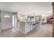 Bright kitchen with a breakfast bar, tile floors, and white cabinetry at 1631 Ottawa Dr, Las Vegas, NV 89169