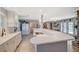 Bright, open kitchen featuring sleek white cabinetry, an expansive bar top, and modern appliances at 1631 Ottawa Dr, Las Vegas, NV 89169