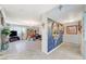 Living room featuring a stone fireplace and views of a dining area at 1631 Ottawa Dr, Las Vegas, NV 89169