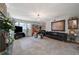 Spacious living room with a fireplace, sleek furniture, and ample natural light at 1631 Ottawa Dr, Las Vegas, NV 89169