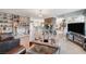Living room featuring a stone column with access to a kitchen and modern decor at 1631 Ottawa Dr, Las Vegas, NV 89169
