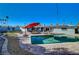 Backyard featuring a pristine in-ground pool and well-manicured landscaping at 1631 Ottawa Dr, Las Vegas, NV 89169