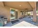 Back patio featuring a ceiling fan, sliding glass door, grill and outdoor furniture, perfect for relaxation and entertaining at 1641 Blue Cliffs Ave, Henderson, NV 89014