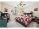 Bedroom with ceiling fan, and a large window for lots of natural light at 1641 Blue Cliffs Ave, Henderson, NV 89014