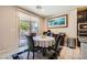 Breakfast nook features sliding glass doors with backyard access, and is adjacent to kitchen at 1641 Blue Cliffs Ave, Henderson, NV 89014