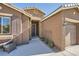 Inviting entryway featuring a stone-accented facade and a cozy sitting area at 1641 Blue Cliffs Ave, Henderson, NV 89014