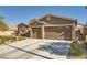 Beautiful single-story home boasts a three-car garage and well-maintained landscaping at 1641 Blue Cliffs Ave, Henderson, NV 89014