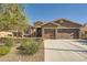 Charming single-story home with stone accents, a three-car garage, and desert landscaping at 1641 Blue Cliffs Ave, Henderson, NV 89014