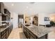 Stylish kitchen featuring a spacious island with seating and modern appliances at 1641 Blue Cliffs Ave, Henderson, NV 89014