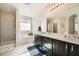 Luxurious main bathroom with double sinks, a soaking tub, and a separate shower at 1641 Blue Cliffs Ave, Henderson, NV 89014