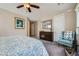 Spacious main bedroom with plush carpet and neutral walls with dark wood furniture at 1641 Blue Cliffs Ave, Henderson, NV 89014