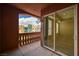 Outdoor balcony with arched stucco ceiling, columns, beautiful exterior view, and sliding door to room at 20 E Serene Ave # 401, Las Vegas, NV 89123