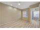 Neutral bedroom has hard surface floors, ceiling fan, and large window for natural light at 20 E Serene Ave # 401, Las Vegas, NV 89123