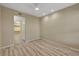 Bedroom with walk-in closet, modern ceiling fan and wood-style floors at 20 E Serene Ave # 401, Las Vegas, NV 89123