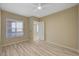 This bedroom features beautiful wood floors, a ceiling fan, and a window with wood blinds at 20 E Serene Ave # 401, Las Vegas, NV 89123