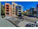 Exterior view of a colorful condo building with balconies and an underground parking garage at 20 E Serene Ave # 401, Las Vegas, NV 89123