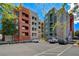 Stunning view of the colorful condo building, showcasing its architectural design and ample parking at 20 E Serene Ave # 401, Las Vegas, NV 89123