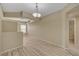 Open living room with neutral walls, modern lighting, and views of the bathroom at 20 E Serene Ave # 401, Las Vegas, NV 89123